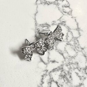 Silver bow tie rhinestone earrings